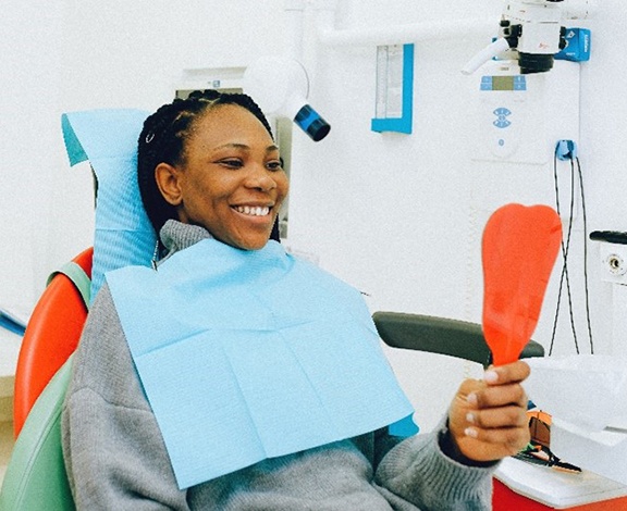 Dental hygienist holding polishing instrument