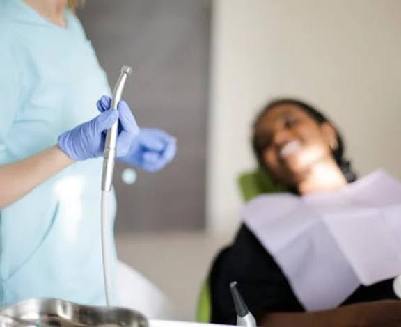 Dental instruments and close up of woman’s teeth